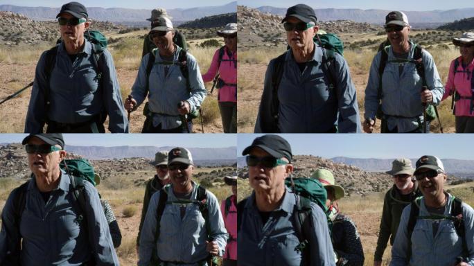 一小群游客在落基山沙漠高山上徒步旅行
