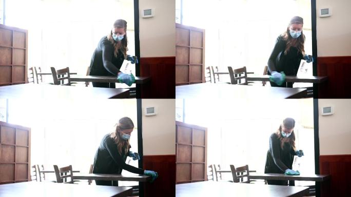 女服务员在擦桌子传染病年轻女性喷雾瓶