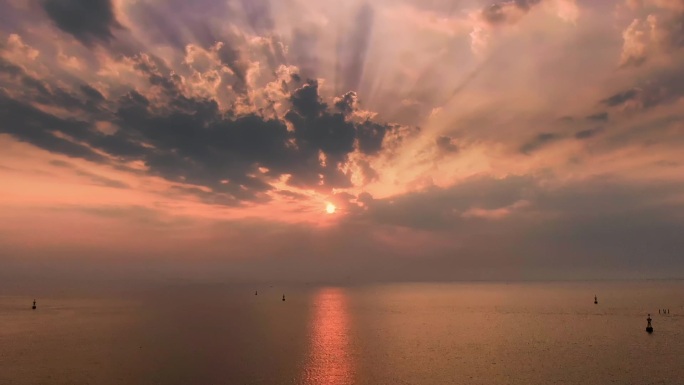 航拍 大海海面夕阳上帝之光延时视频