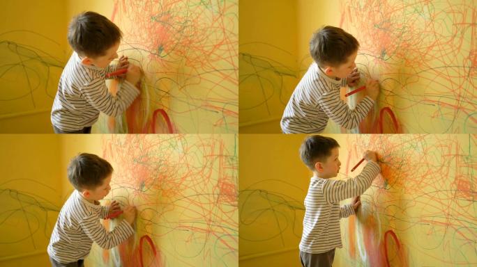 男孩在家里的墙上画画