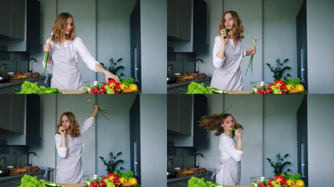 快乐女孩用黄瓜做麦克风在厨房里跳舞唱歌