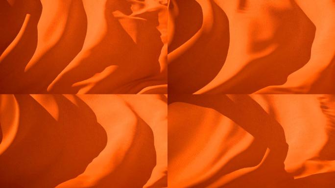 橙色织物在风中飘动抽象背景