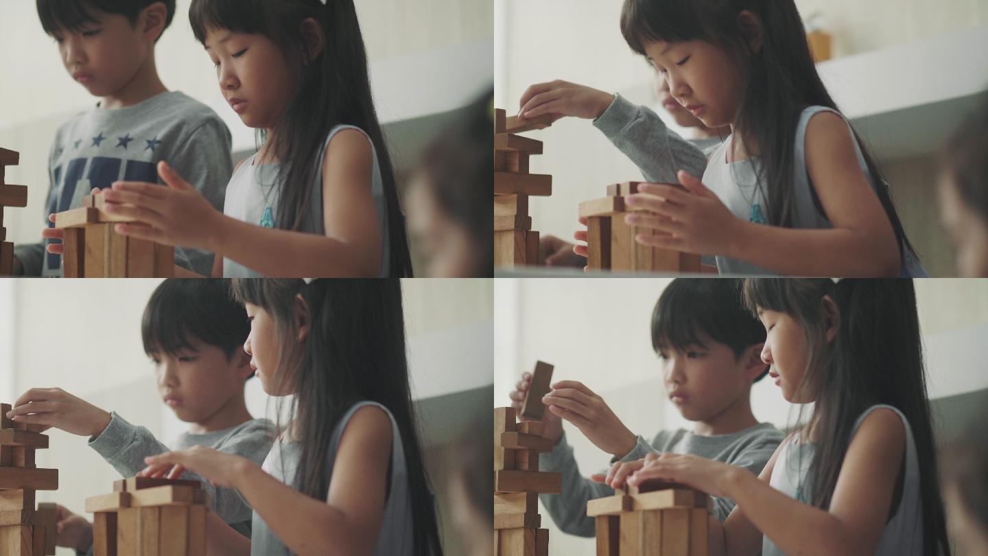 玩木制玩具积木的孩子们