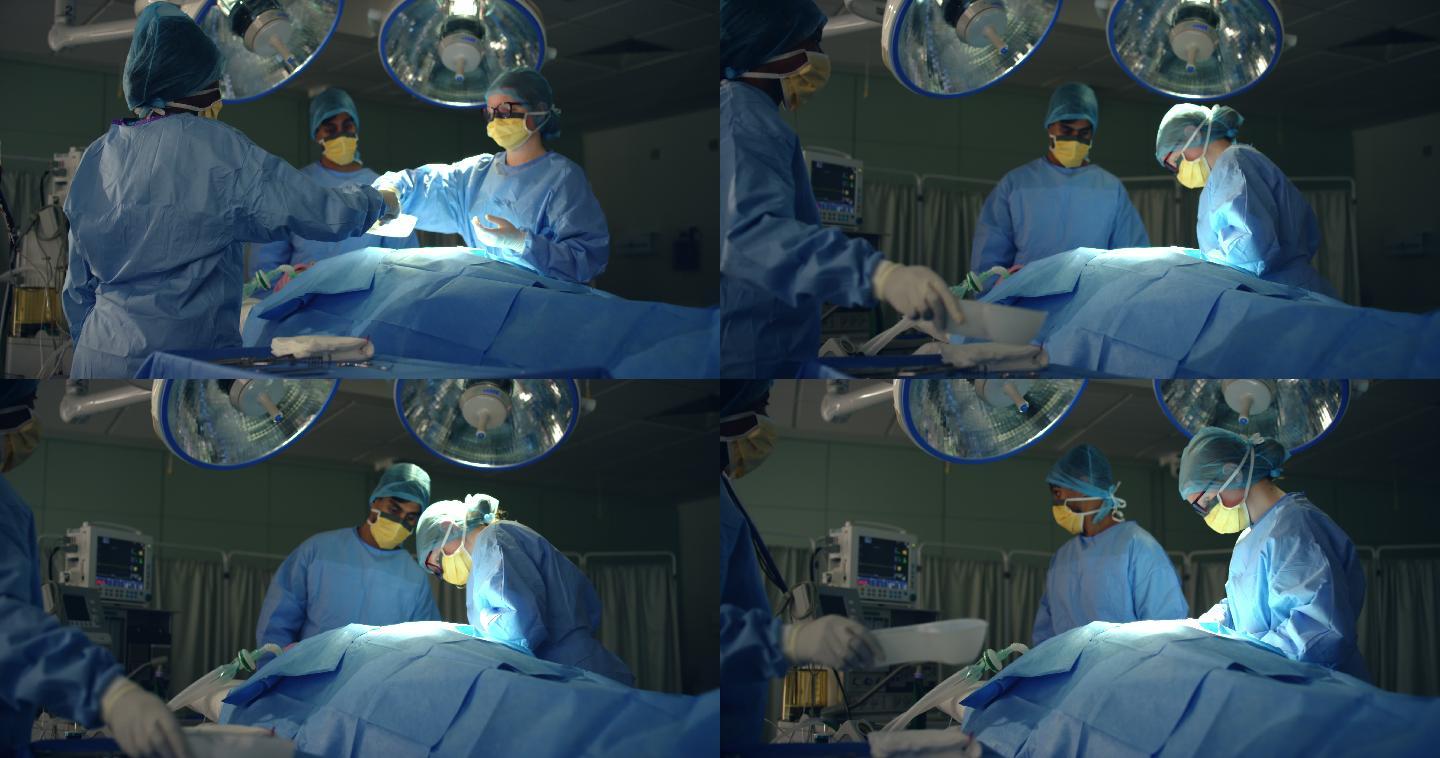 助手把手术刀递给外科医生