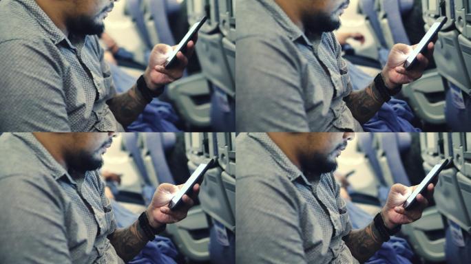 在使用手机的乘客手机触屏发消息智能机