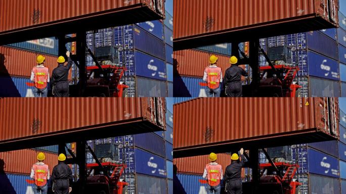 两名工程师在船坞处理集装箱货运