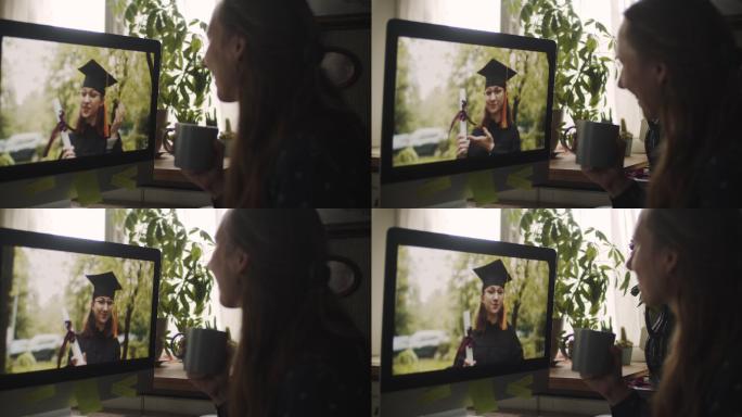 一名女子在家通过视频电话庆祝青少年毕业
