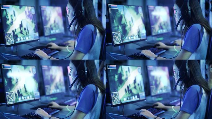 职业玩家在电脑上玩战略视频游戏。
