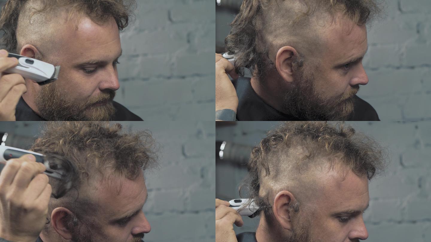 一个留胡子的男人用电动剃须刀剃头