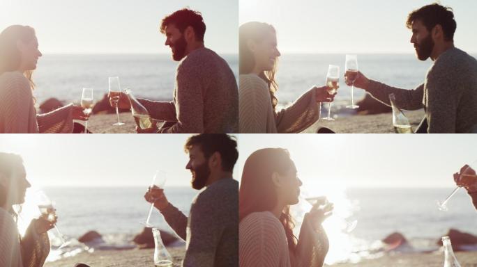 年轻夫妇在海滩边喝酒