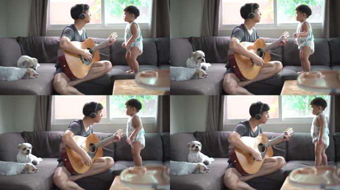 父亲在家教儿子学吉他。