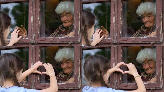 小女孩透过窗户探望祖母