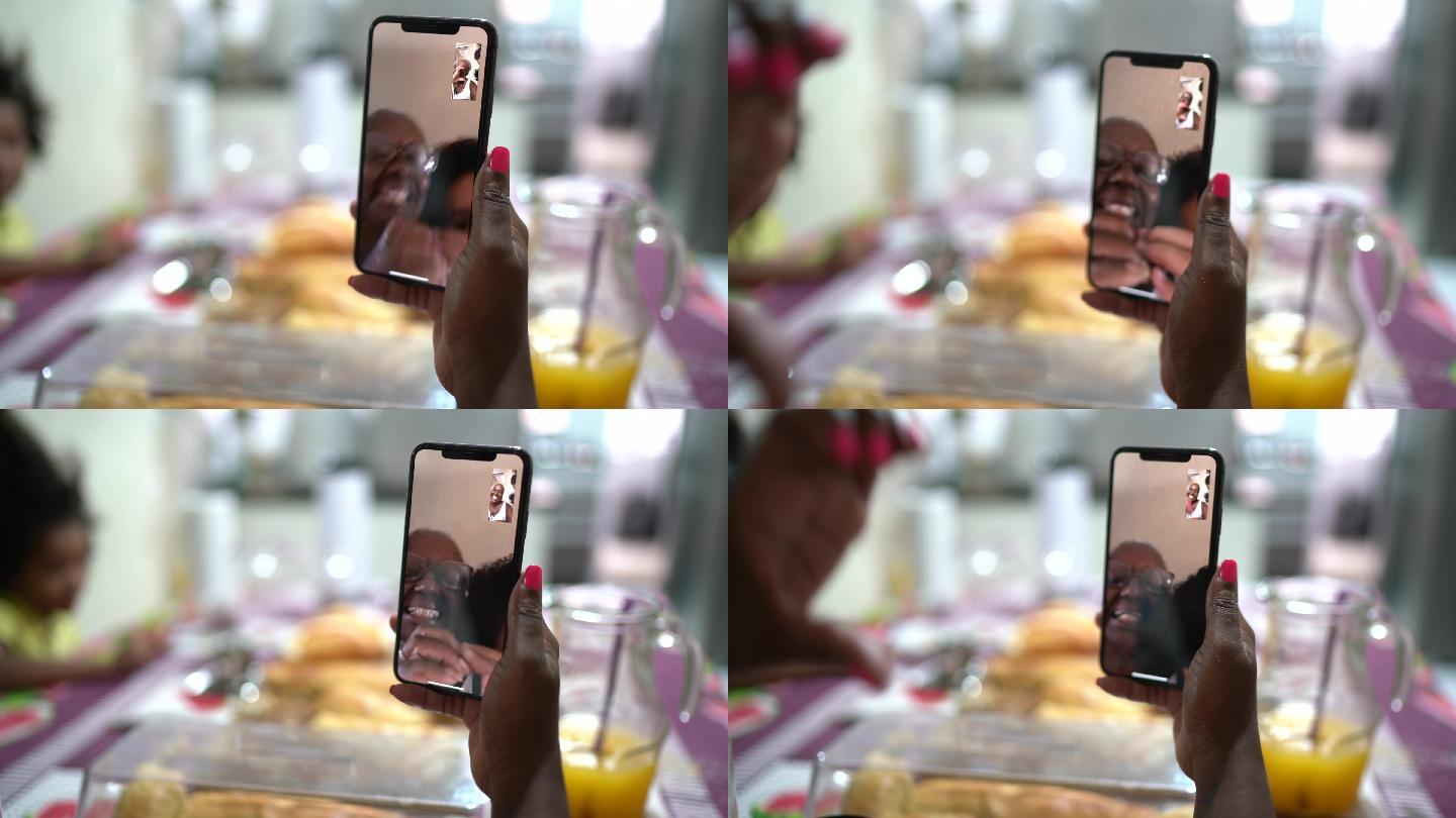 在家吃早餐时用手机视频聊天的女人