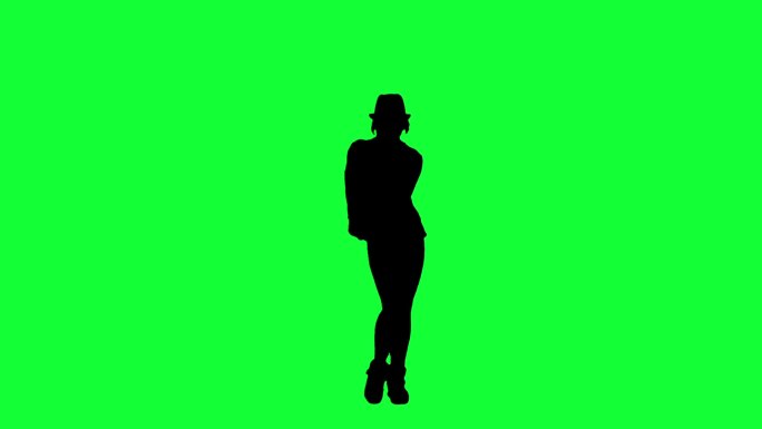 一个女人在绿色背景下跳舞的剪影