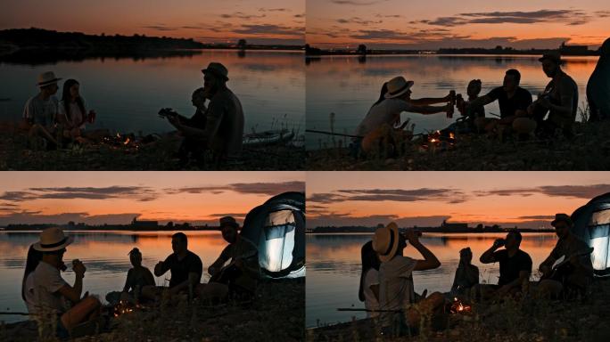 黄昏时分，一群年轻人在湖边露营