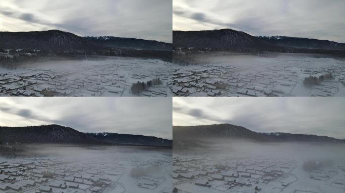 航拍新疆冬日的禾木村晨雾