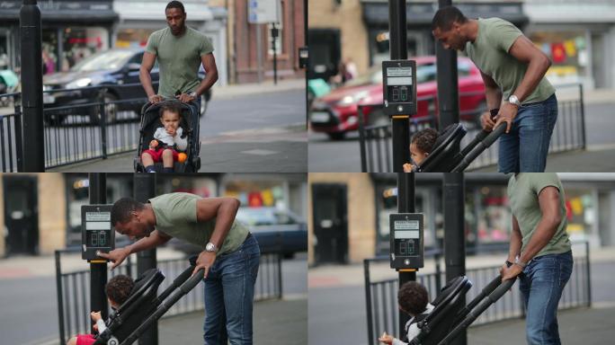 男人推着儿童推车过人行道