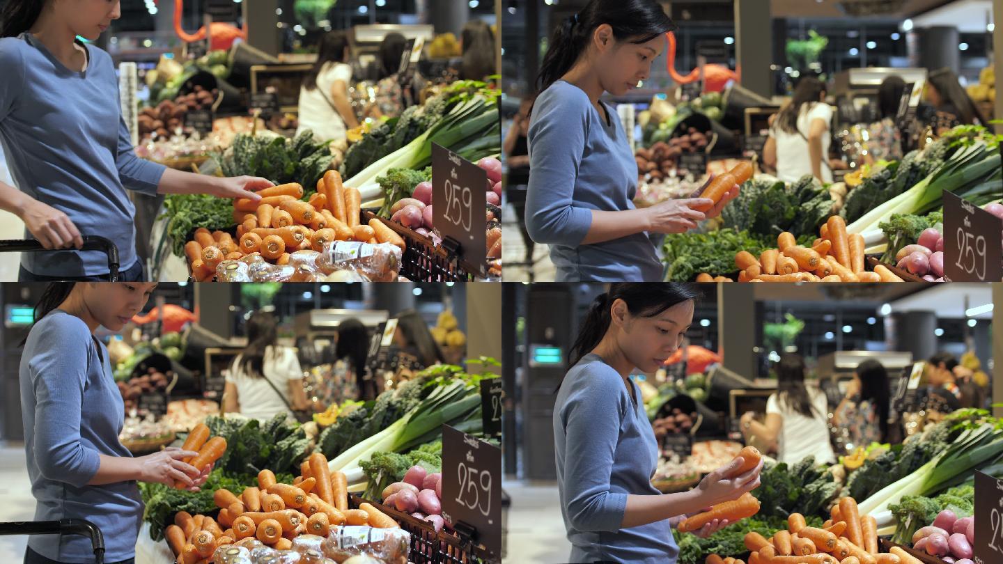亚洲妇女在超市挑选蔬菜