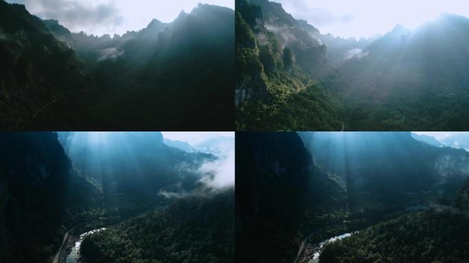 逆光下云雾缭绕的高山山谷