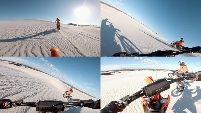 摩托车手在沙漠中驾驶摩托车