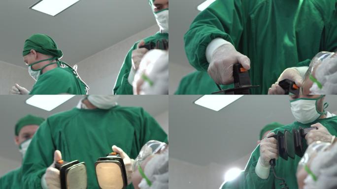 医生在手术期间使用除颤器帮助患者