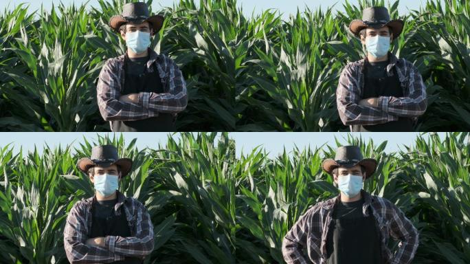 年轻的农场工人戴着防护口罩看着摄像机