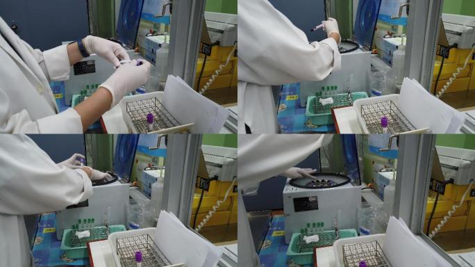 医疗技术人员正在使用血样分析