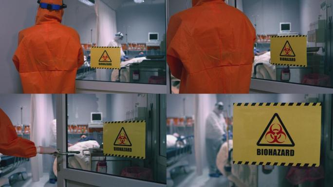 身穿橙色防护服的医生进入实验室