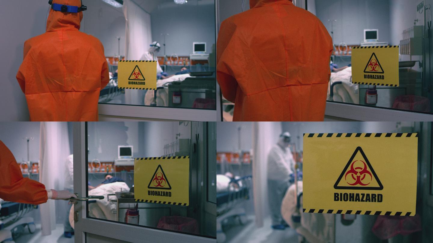 身穿橙色防护服的医生进入实验室