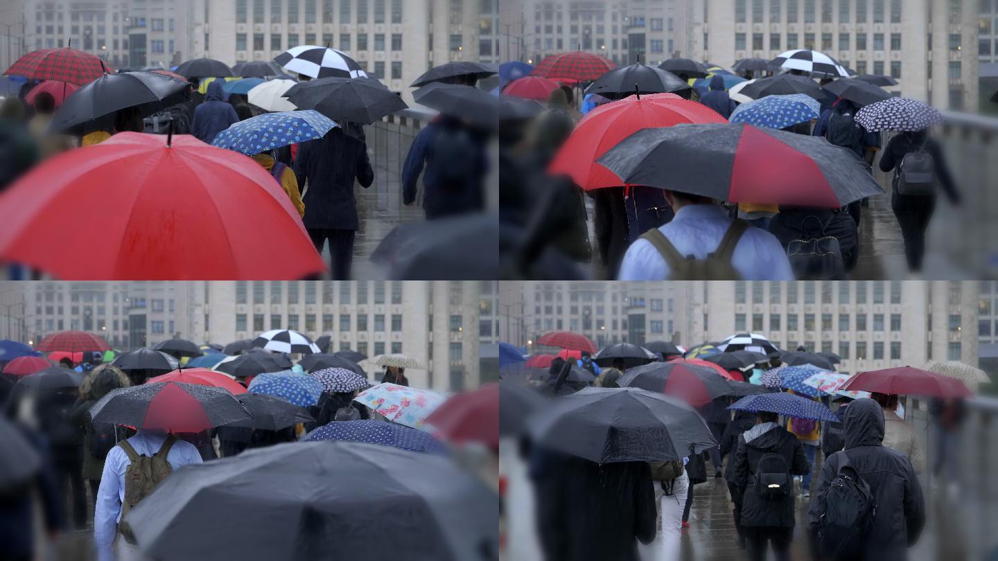 在雨中打着雨伞的上班族