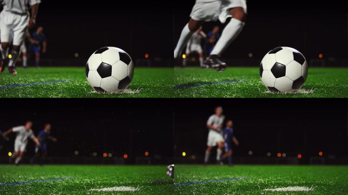 夜间慢动作踢足球的特写镜头