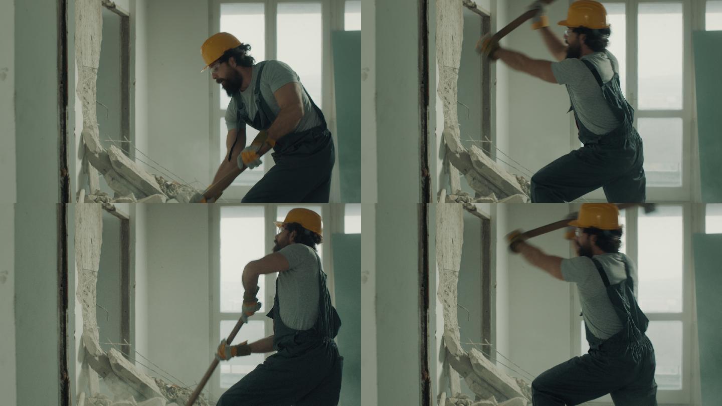建筑工人用大锤拆墙