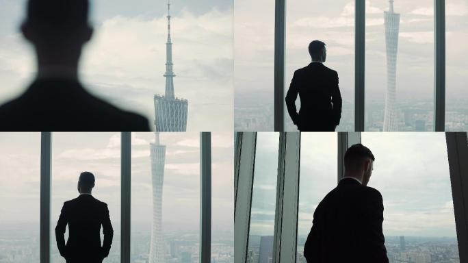 商务成功人士看向窗外广州塔俯瞰广州