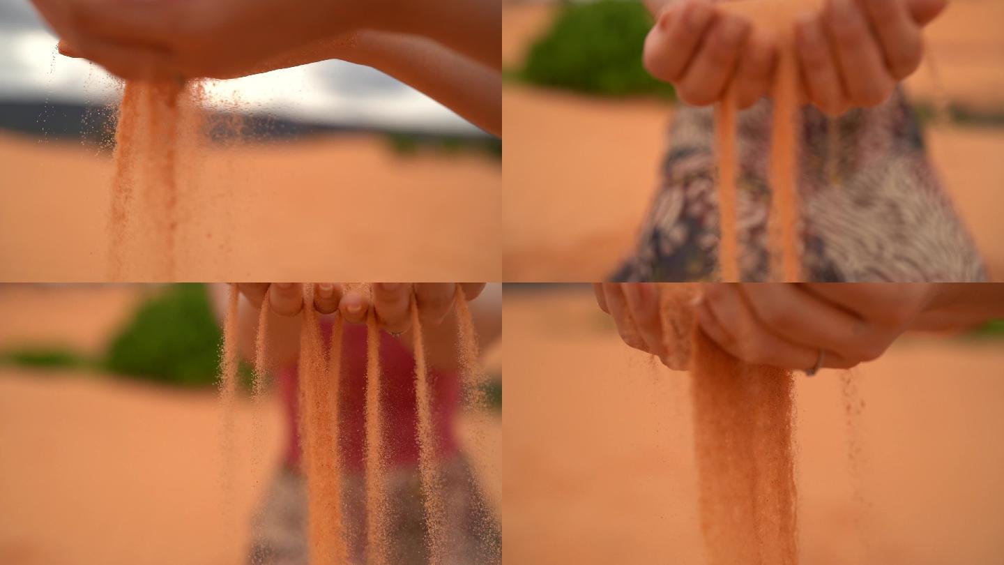 女人用手捧沙子，倒沙子
