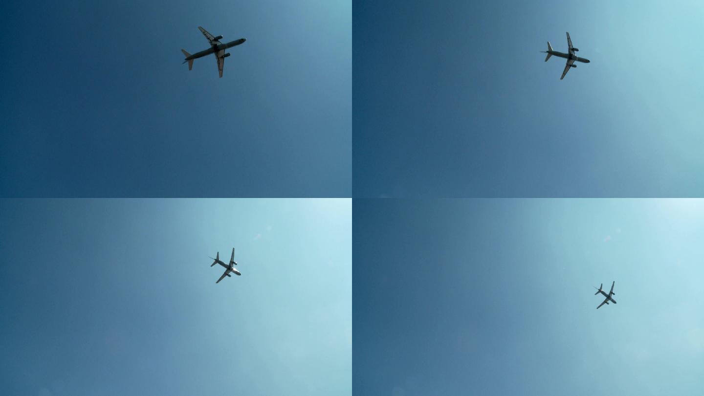 飞越上空的飞机仰视仰拍航天高空蓝天