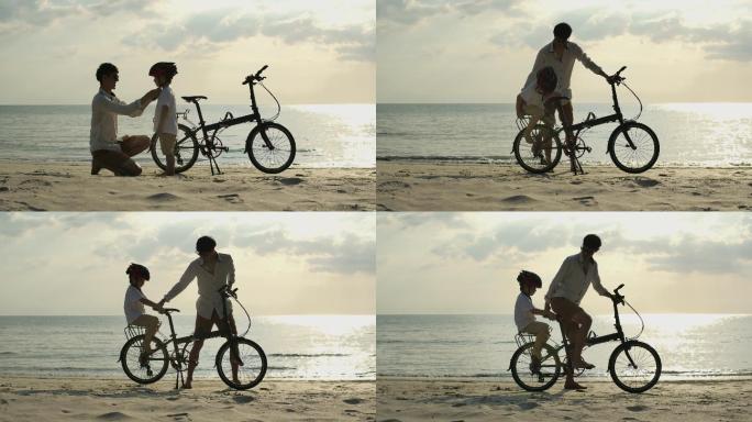 爸爸和儿子在海滩上骑自行车