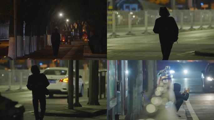 深夜北京街道，行人稀少，走路背影
