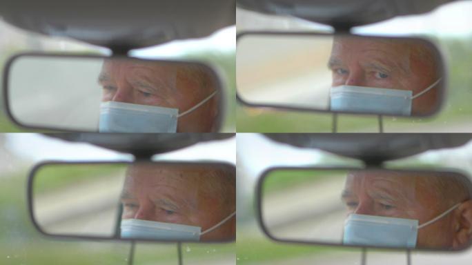 老年人在流感流行期间戴着口罩开车
