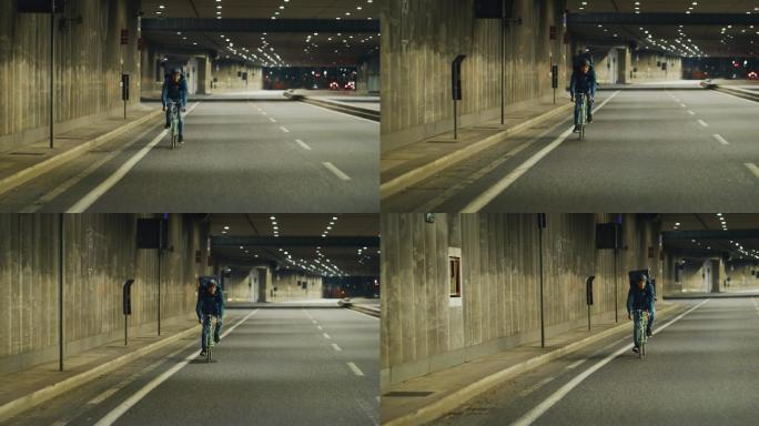 一个骑着自行车的快递员在街道上