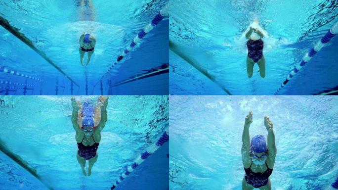 年轻女子游泳蛙泳的水下镜头