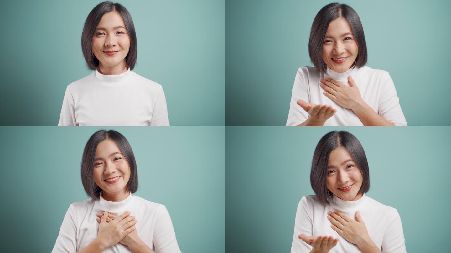 女人看着镜头,用手语说谢谢