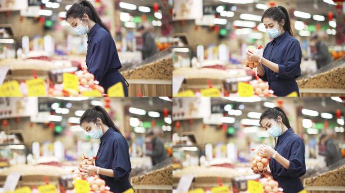 年轻中国女性戴着口罩在超市选购鸡蛋