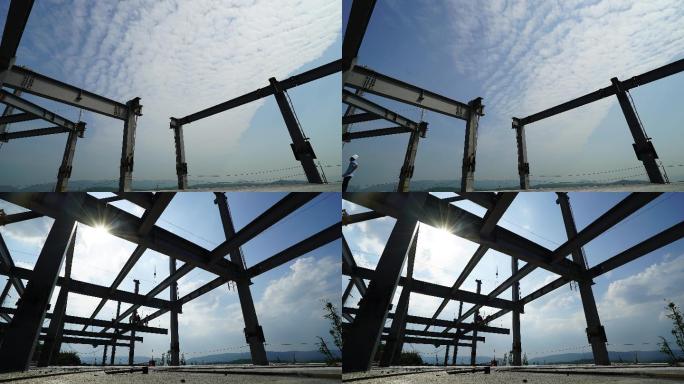 蓝天白云下的建筑工地吊装钢结构延时摄影
