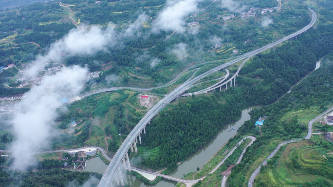 航拍山区云雾下的乡镇高速公路