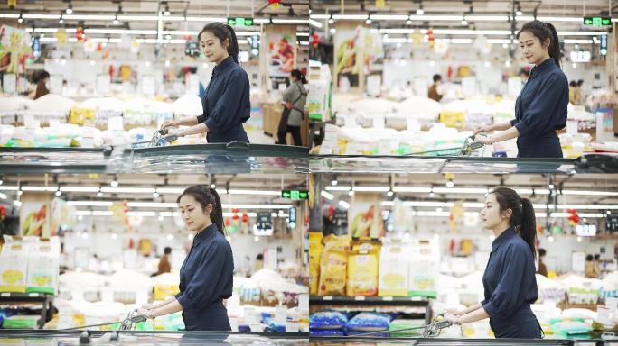 年轻中国女性在生鲜超市购物
