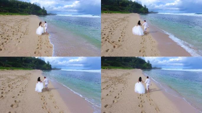 海边沙滩情侣恋人穿着婚纱牵手奔跑