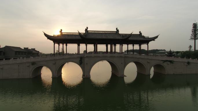 航拍开封朱仙镇夕阳下的拱桥亭子