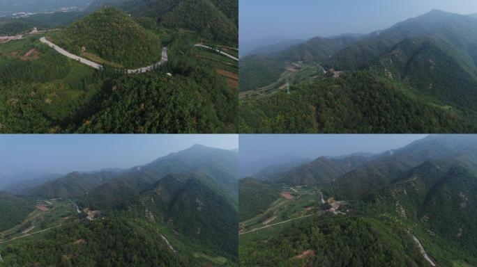 山峰间的盘山公路树木森林