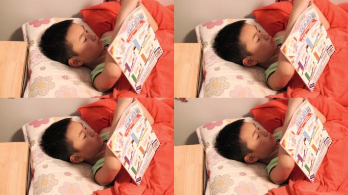 4K小学生晚上躺在床上看书