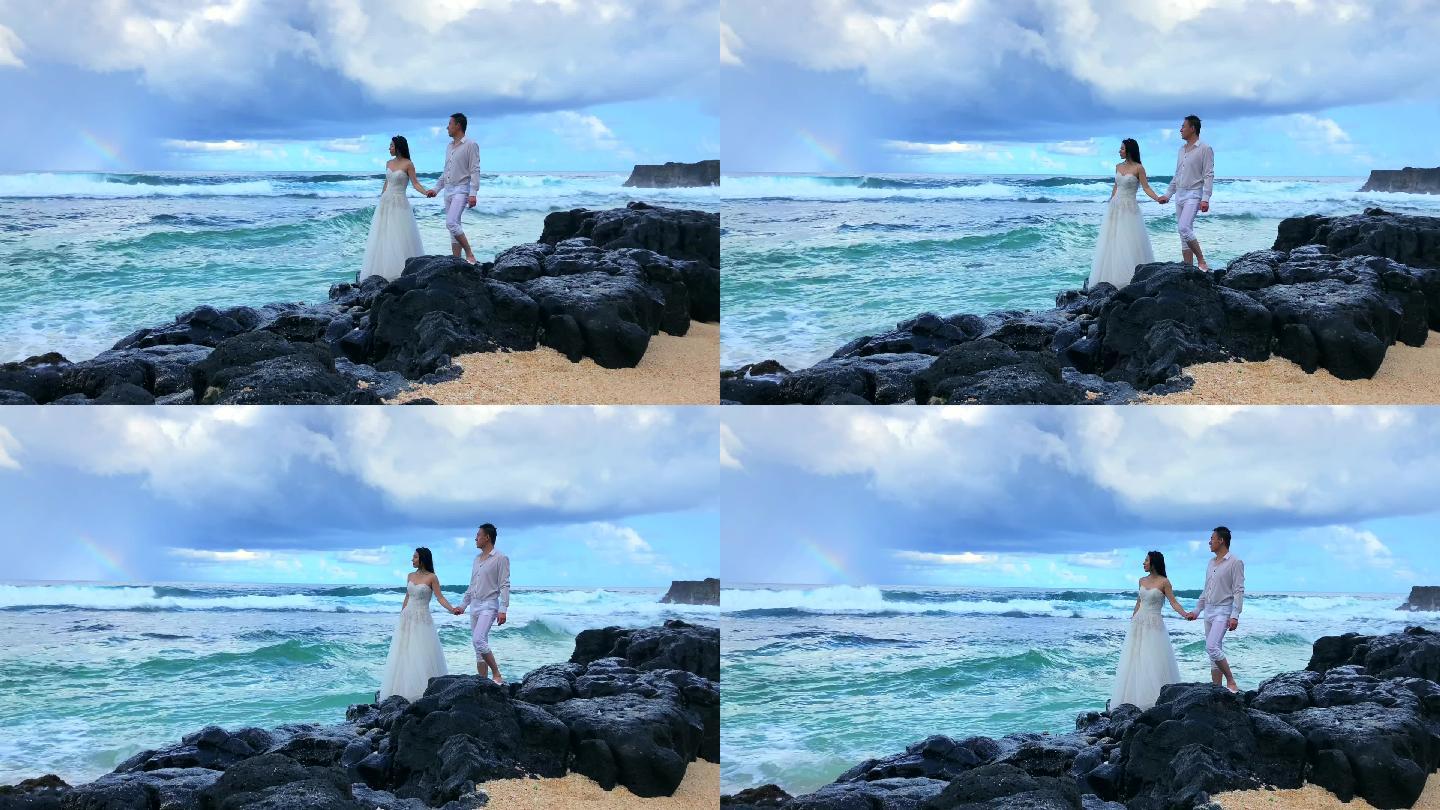 浪漫情侣海边看海浪彩虹